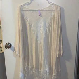 cream cardigan with lace design on back